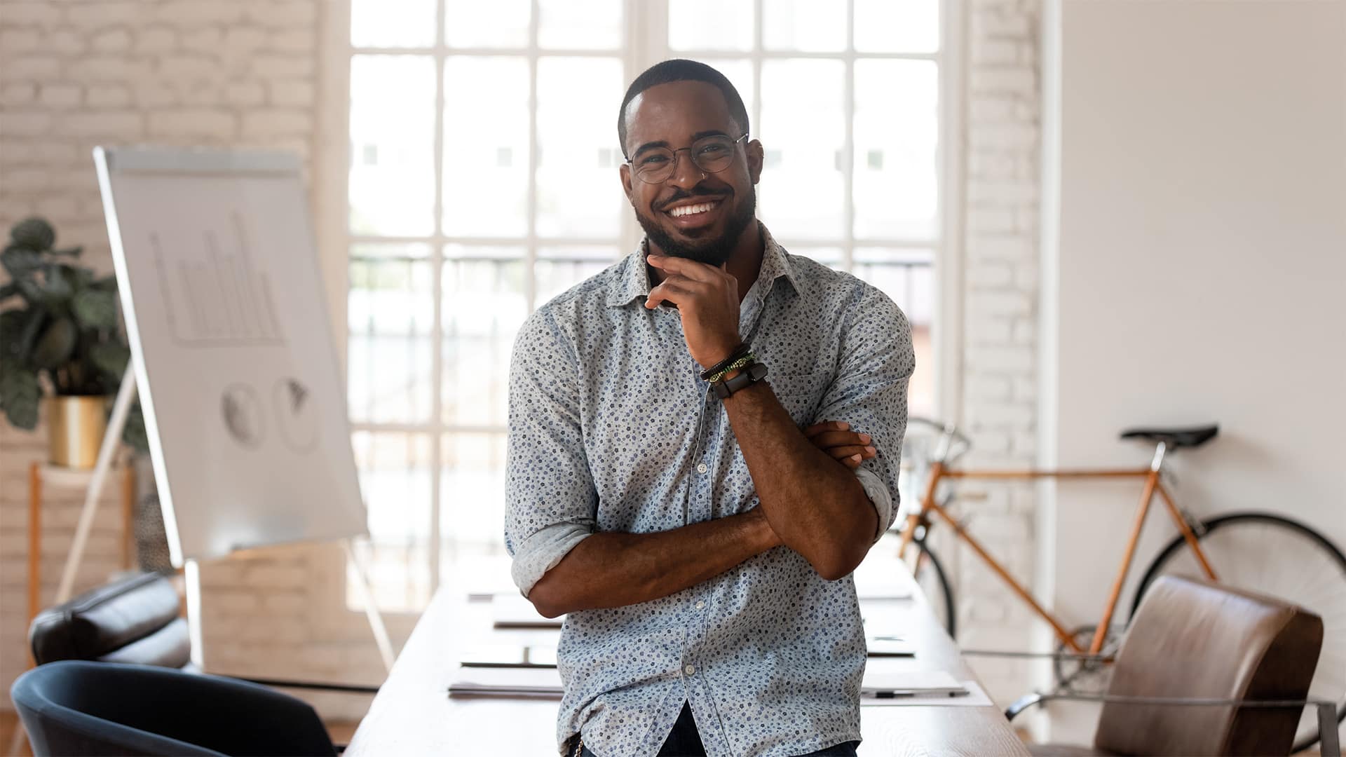 A photo of a man smiling.